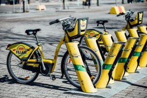 A bicycle parked in a bicycle rack.