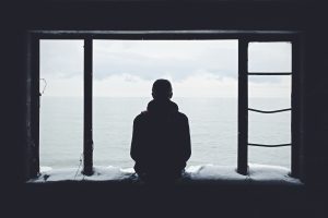 A person looking out through the window.