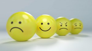 Four emoticons expressing sadness, happiness, anger, and anxiety.
