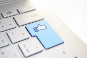 The Facebook like icon on a keyboard.