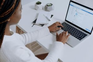 A person using Facebook on their laptop.