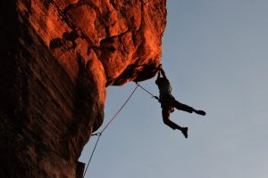 A person rock climbing.