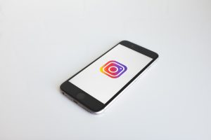 A phone with the Instagram icon on its screen.