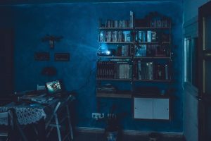 A cinema projector in a dimly lit room.