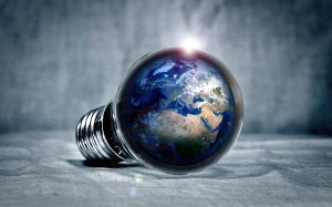 A light bulb with an illustration of the planet Earth inside.