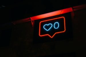A neon sign with a heart and a zero.