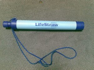 A Lifestraw placed on the ground.