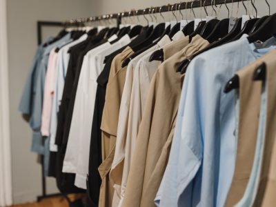 Clothing rack full of various hanging tops