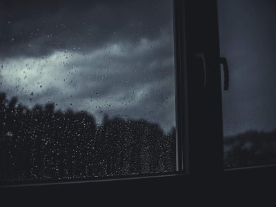 A window showing a dark rainy night.