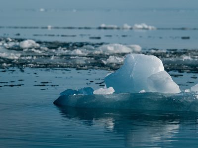 A tranquil scene of an iceberg in the vast Arctic Ocean