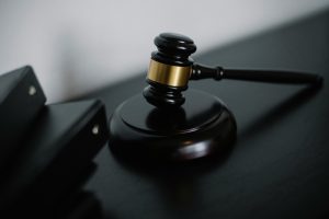 A picture of a small, black gavel.