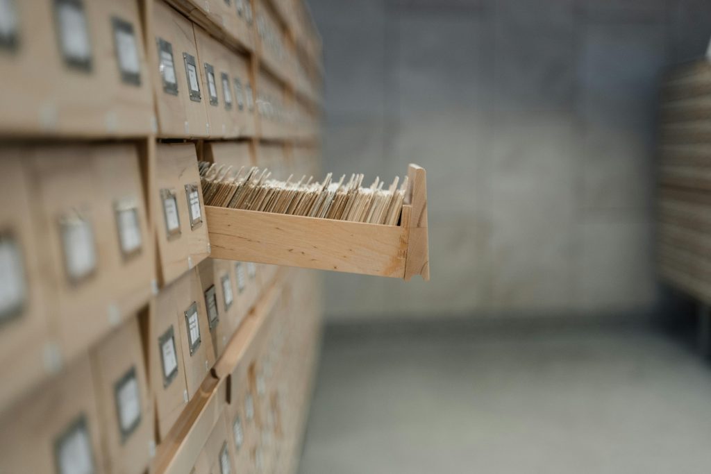A file cabinet with one drawer open. 