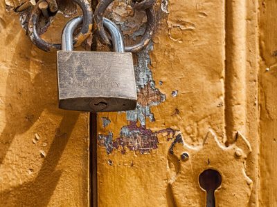 a photo of a lock around a door and a keyhole.