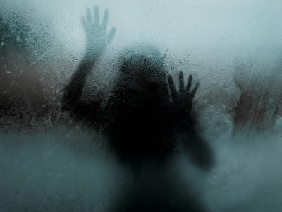 Shadow of girl behind a mirror.