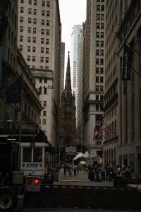 crowded-city-people A city with tall white buildings and a busy crowd.