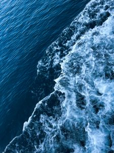 Whitecap waves on deep blue water