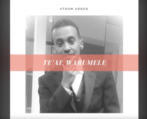 Screenshot of a music album of Atham Addus, with a black and white photo of him with his name in the middle in red. 