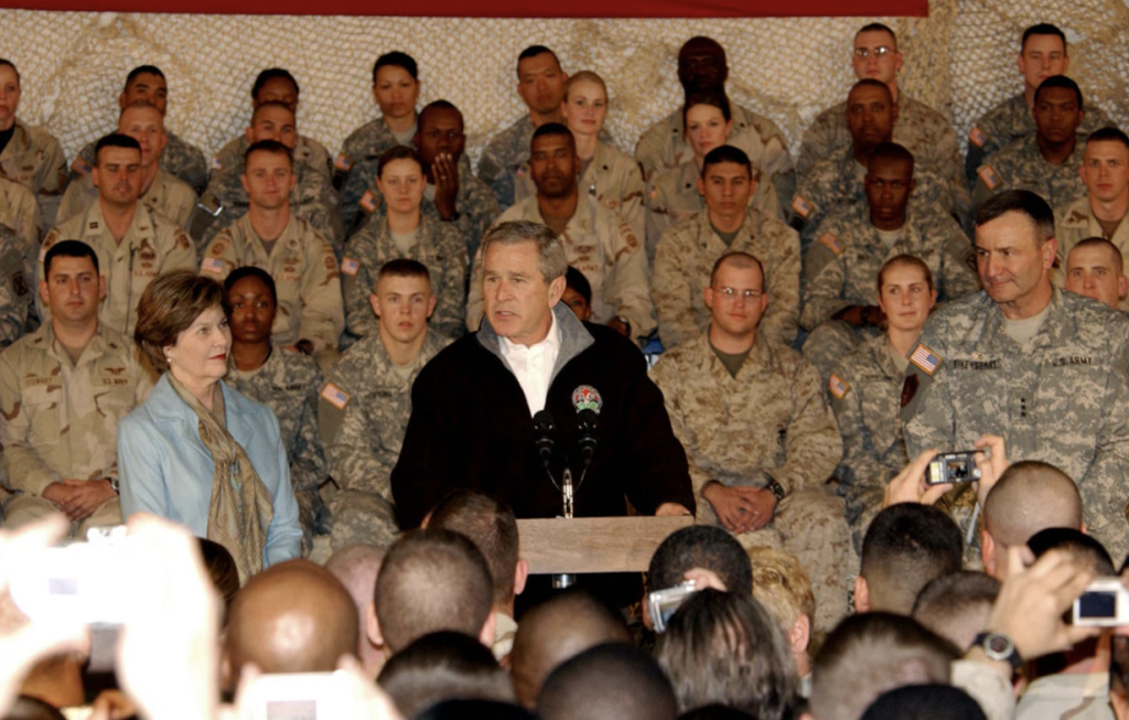 President George W. Bush, the First Lady, Laura Bush, and Lt. Gen. Karl Eikenberry, Combined Forces Command — Afghanistan commander, pay a surprise visit to troops here March 1. (U.S. Army photo/Pfc. Brian Schroeder) Public Domain Copyright Free