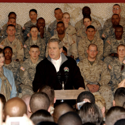 President George W. Bush, the First Lady, Laura Bush, and Lt. Gen. Karl Eikenberry, Combined Forces Command — Afghanistan commander, pay a surprise visit to troops here March 1. (U.S. Army photo/Pfc. Brian Schroeder) Public Domain Copyright Free