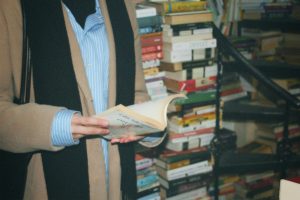 Hands of woman reading book