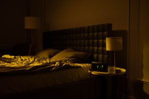 Comforting image of bed warmly lit